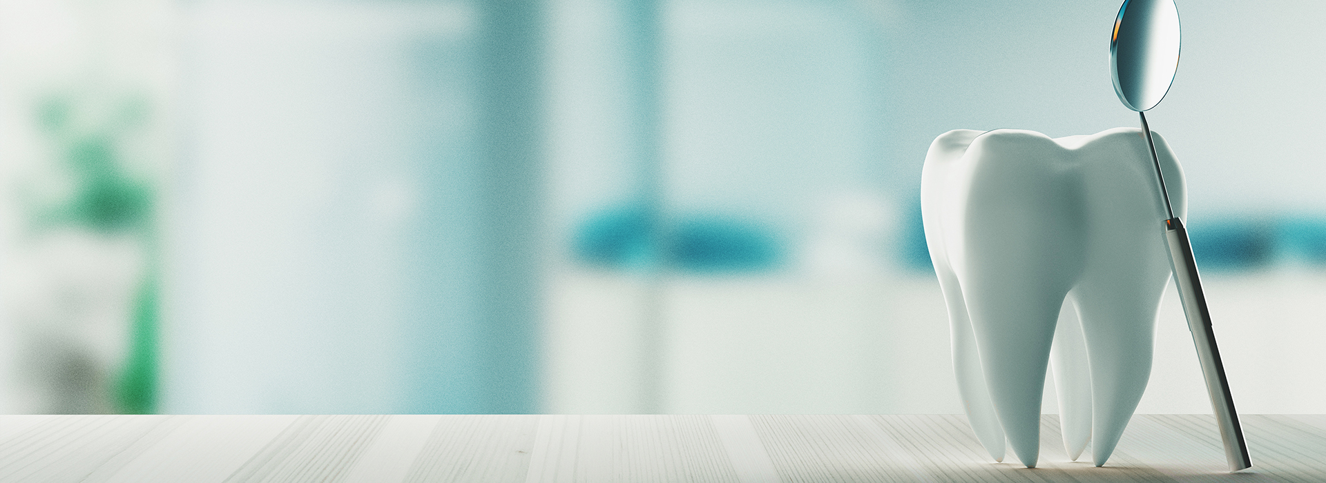 The image shows a close-up view of a toothbrush with a blue background featuring blurred elements that suggest a modern, possibly medical setting.